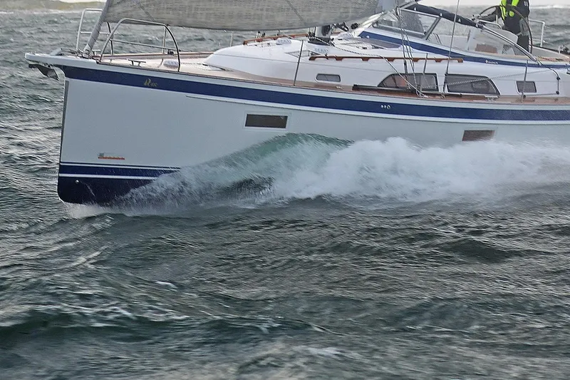 Slide: The Image of Sailing yacht Hallberg-Rassy 40C 2021 navigating through waves. - 13