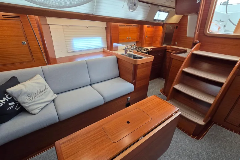Slide: The Image of Interior of 2021 Hallberg-Rassy 40C yacht with cozy seating and modern kitchen. - 23