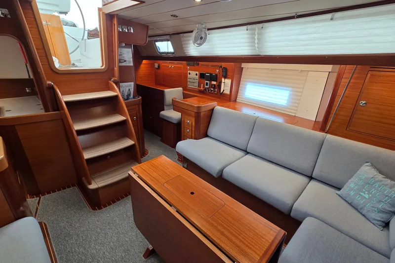 Slide: The Image of Luxurious interior of 2021 Hallberg-Rassy 40C yacht with elegant wood finish and comfortable seating. - 24