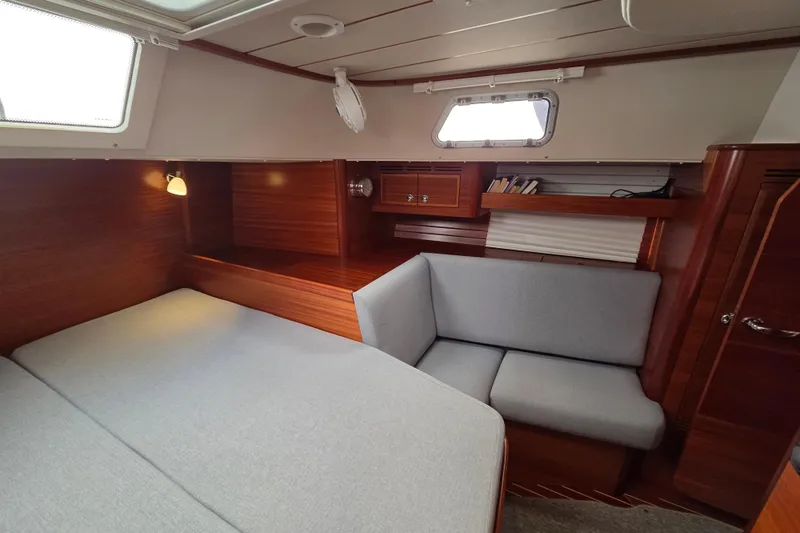 Slide: The Image of Cozy interior of 2021 Hallberg-Rassy 40C yacht with wooden finish and comfortable seating. - 38