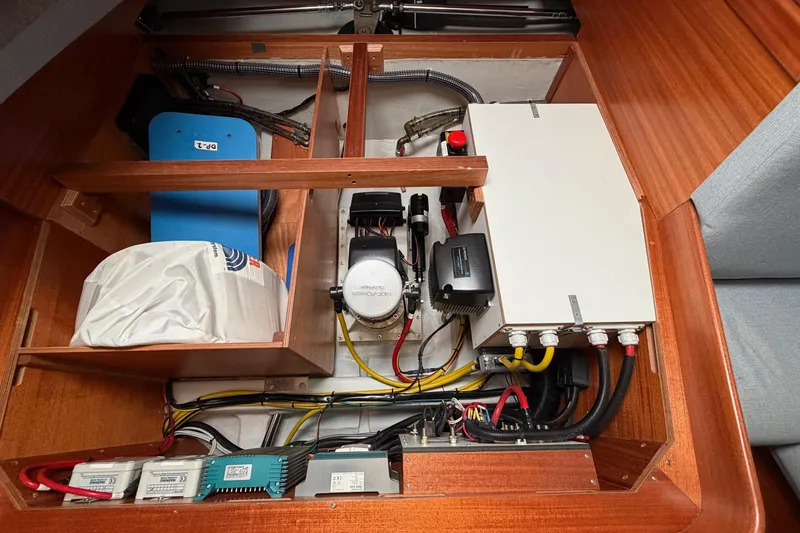 Slide: The Image of Engine compartment of 2021 Hallberg-Rassy 40C yacht, showcasing wiring and equipment. - 39