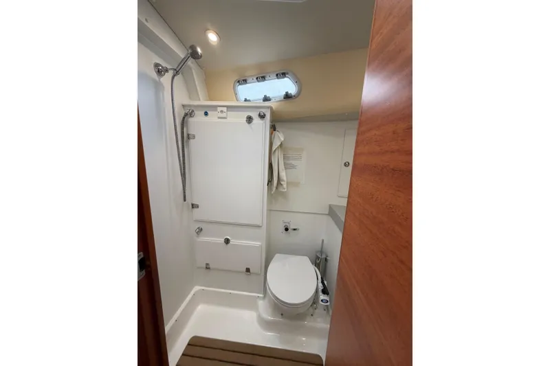 Slide: The Image of Bathroom interior of 2021 Hallberg-Rassy 40C yacht, featuring shower and toilet. - 42