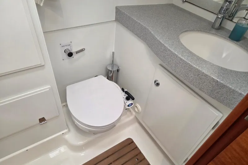 Slide: The Image of Modern bathroom in 2021 Hallberg-Rassy 40C yacht with toilet and sink. - 44