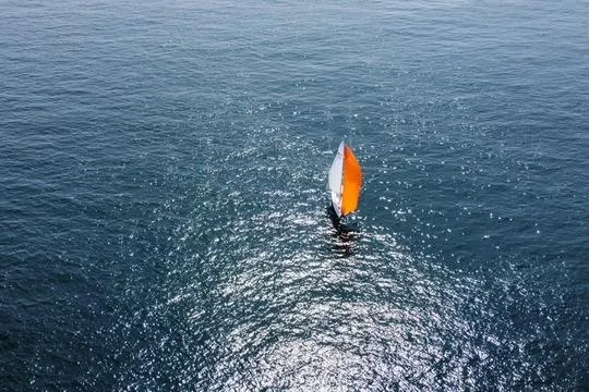 Slide: The Image of Sailboat Hallberg-Rassy 40C 2021 with vibrant sail on open sea. - 5