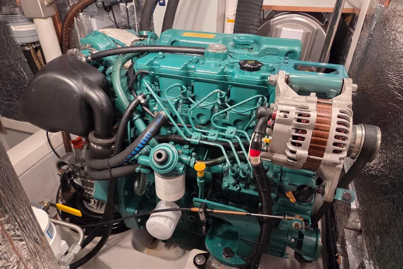 Slide: The Image of Engine of a 2021 Hallberg-Rassy 40C sailboat, showcasing intricate mechanical components. - 51