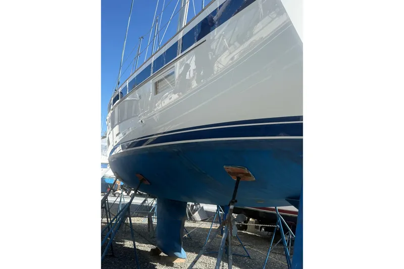 Slide: The Image of Engine room of 2021 Hallberg-Rassy 40C yacht with fire extinguisher and insulation. - 57