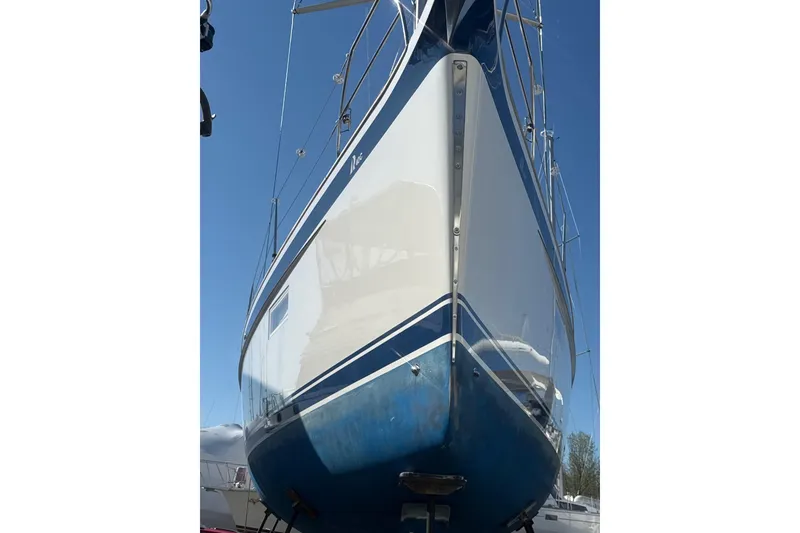 Slide: The Image of Cockpit of 2021 Hallberg-Rassy 40C sailboat with teak wood finish and modern controls. - 62