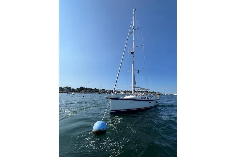 Slide: The Image of Sailing yacht Hallberg-Rassy 40C (2021) anchored in calm waters under clear blue sky. - 7