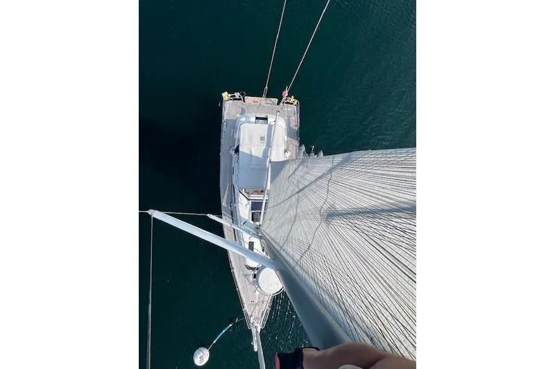 Slide: The Image of Aerial view of 2021 Hallberg-Rassy 40C sailboat on calm water. - 8