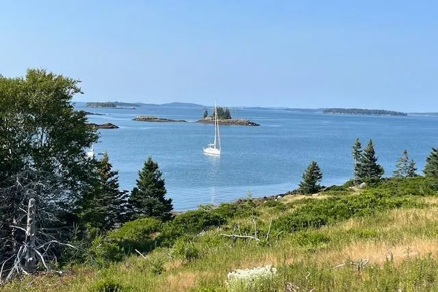 Slide: The Image of Sailboat Hallberg-Rassy 40C (2021) anchored in scenic coastal landscape with islands. - 9
