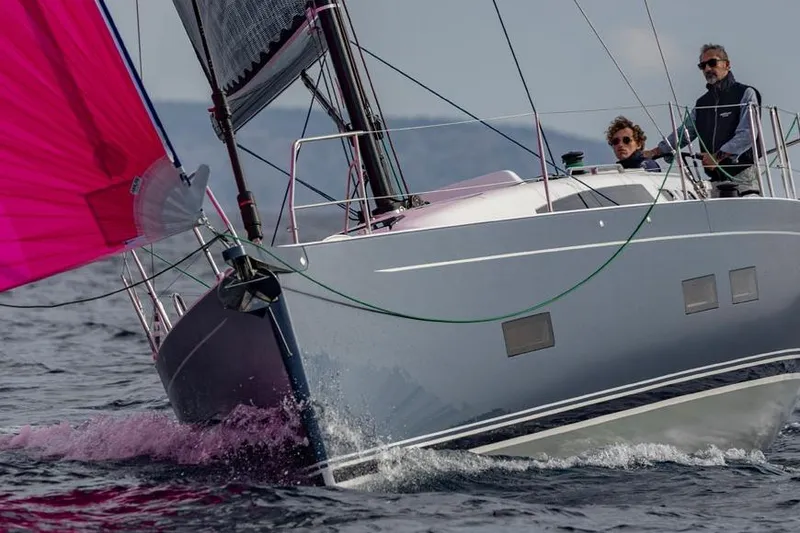 Slide: The Image of 2026 J Boats J/40 sailing with vibrant pink spinnaker on open water. - 10
