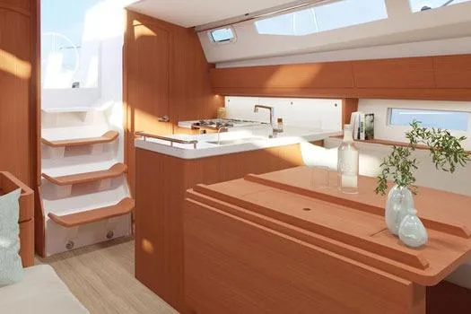 Slide: The Image of 2026 J Boats J/40 interior with modern kitchen, wooden cabinetry, and natural light. - 14