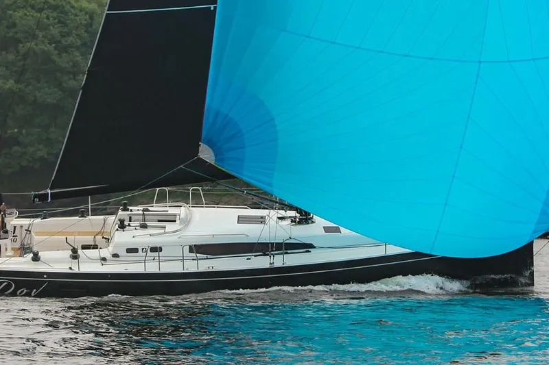Slide: The Image of 2026 J Boats J/40 sailing with vibrant blue spinnaker on open water. - 5