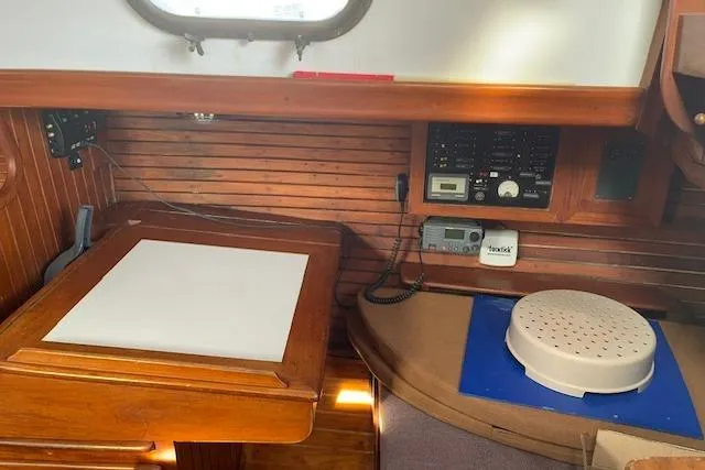 Slide: The Image of Interior of a 1978 Rafiki 35 sailboat with navigation station and equipment. - 14