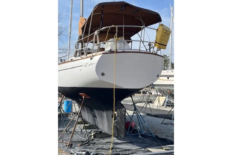 Slide: The Image of 1978 Rafiki 35 sailboat on dry dock, undergoing maintenance. - 6