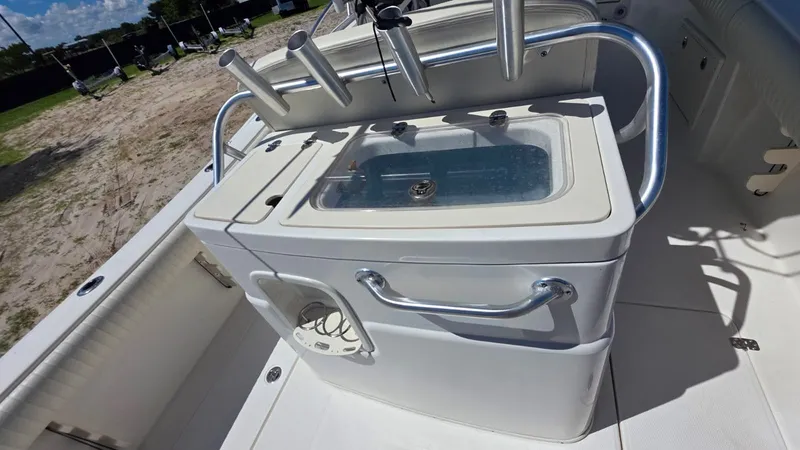 Slide: The Image of Mako 284 Center Console 2020 with rod holders and livewell. - 13