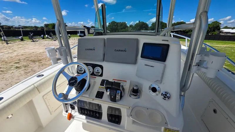 Slide: The Image of Mako 284 Center Console 2020 with Garmin navigation and controls. - 19