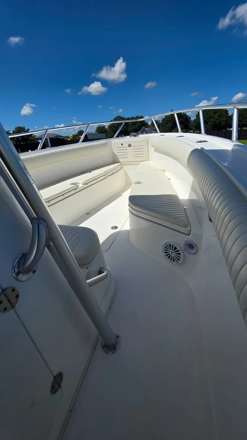 Slide: The Image of Mako 284 Center Console boat, 2020, with white interior and blue sky. - 21