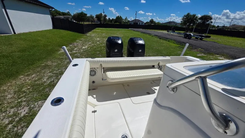 Slide: The Image of Mako 284 Center Console boat, 2020 model, parked on green grass. - 29