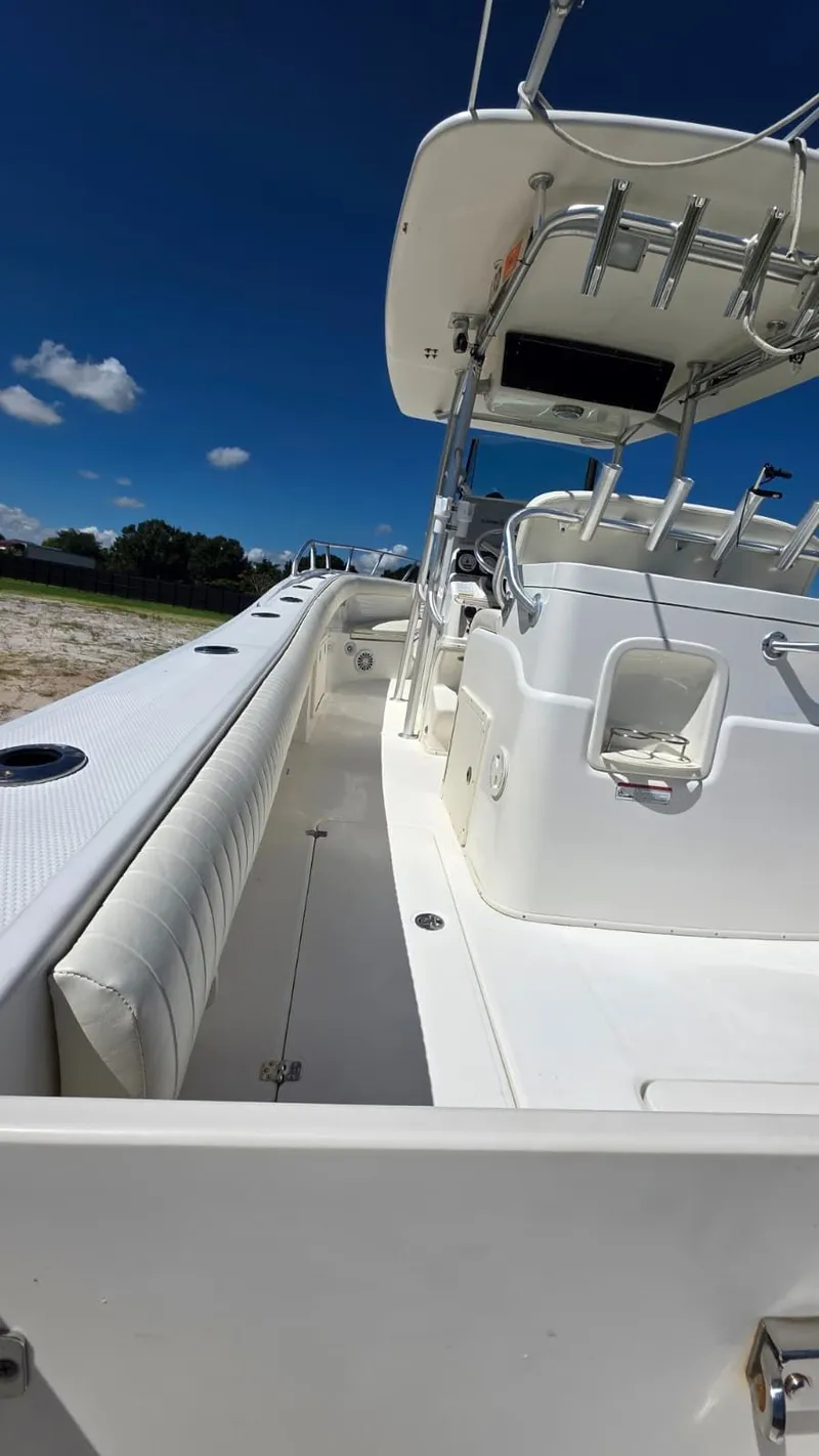 Slide: The Image of Mako 284 Center Console boat, 2020 model, under sunny skies. - 30