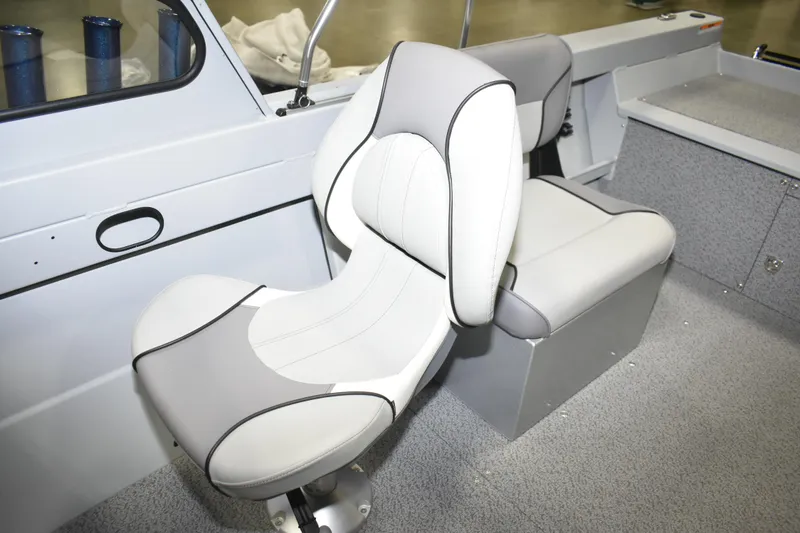 Slide: The Image of Interior seating of 2026 KingFisher 16 Falcon boat, featuring modern gray and white design. - 13
