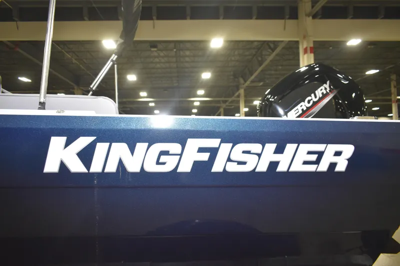 Slide: The Image of 2026 KingFisher 16 Falcon boat displayed indoors, featuring sleek design and seating. - 18
