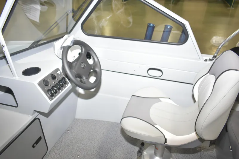 Slide: The Image of Interior of 2026 KingFisher 16 Falcon boat with modern seating design. - 12