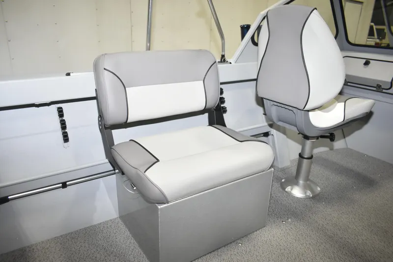 Slide: The Image of Interior of 2026 KingFisher 16 Falcon boat with storage compartment and seating. - 14