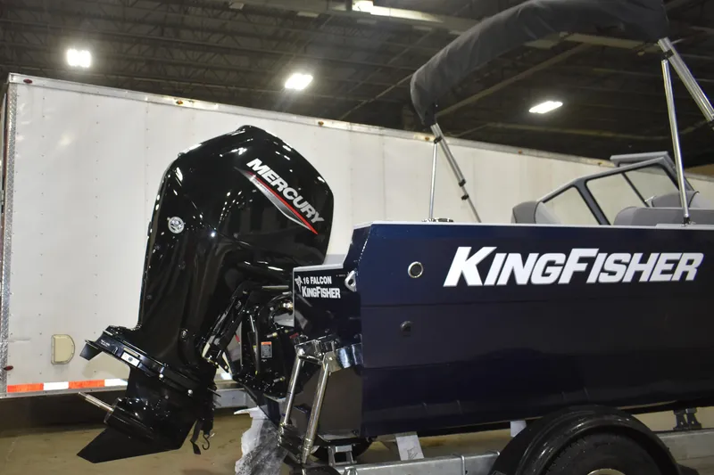 Slide: The Image of 2026 KingFisher 16 Falcon boat with Mercury engine displayed indoors. - 6