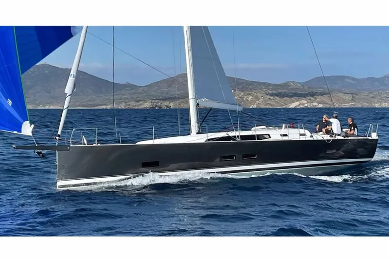 Slide: The Image of Manufacturer Provided Image: 2026 J Boats J/45 sailing on open water with mountainous backdrop. - 1