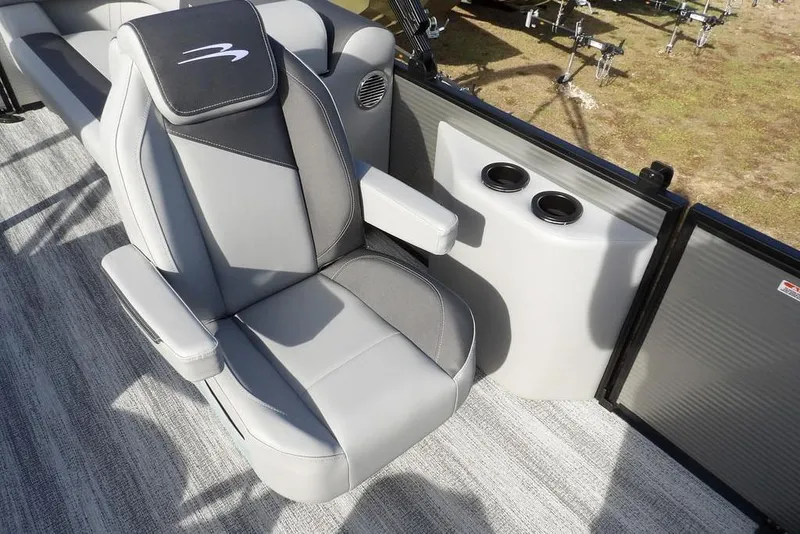 Slide: The Image of 2026 Bennington S 22 SSR boat seat with cup holders, featuring sleek gray upholstery. - 12