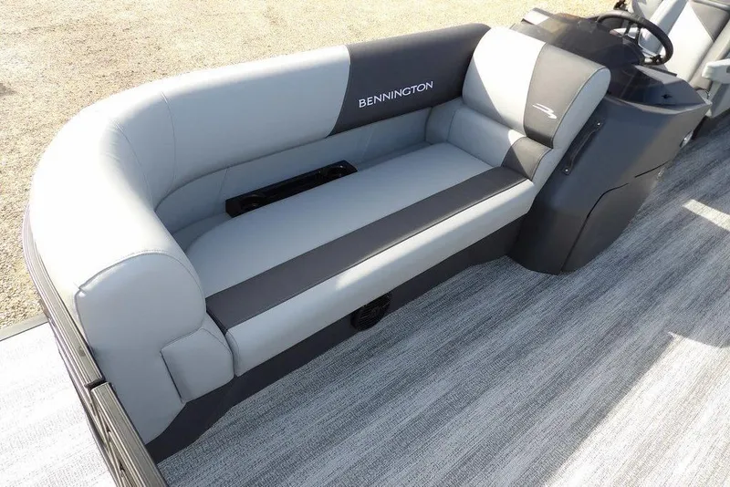 Slide: The Image of 2026 Bennington S 22 SSR boat interior with gray seating and steering console. - 13