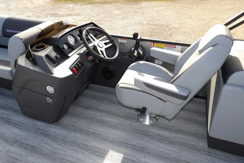 Slide: The Image of 2026 Bennington S 22 SSR boat interior with steering console and captain's chair. - 14