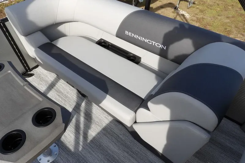 Slide: The Image of 2026 Bennington S 22 SSR boat interior with gray seating and cup holders. - 24