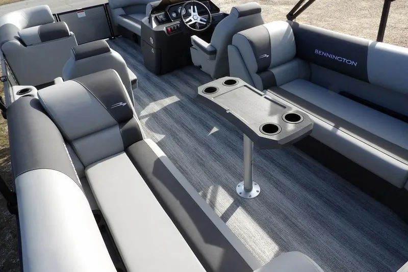 Slide: The Image of 2026 Bennington S 22 SSR pontoon boat interior with gray seating and table. - 25