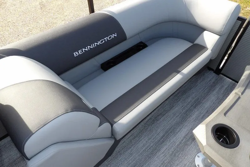 Slide: The Image of 2026 Bennington S 22 SSR boat interior with gray seating and cup holders. - 26