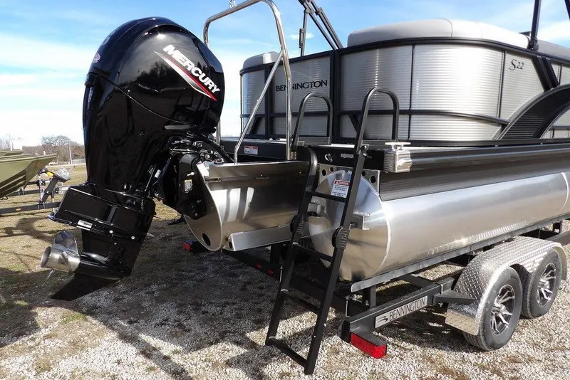 Slide: The Image of 2026 Bennington S 22 SSR pontoon boat with Mercury outboard engine on trailer. - 27
