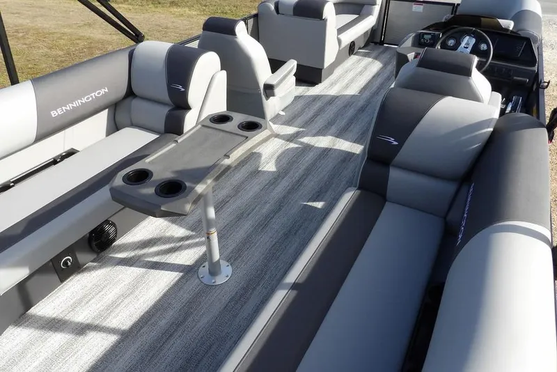 Slide: The Image of 2026 Bennington S 22 SSR pontoon boat interior with gray seating and cup holders. - 28