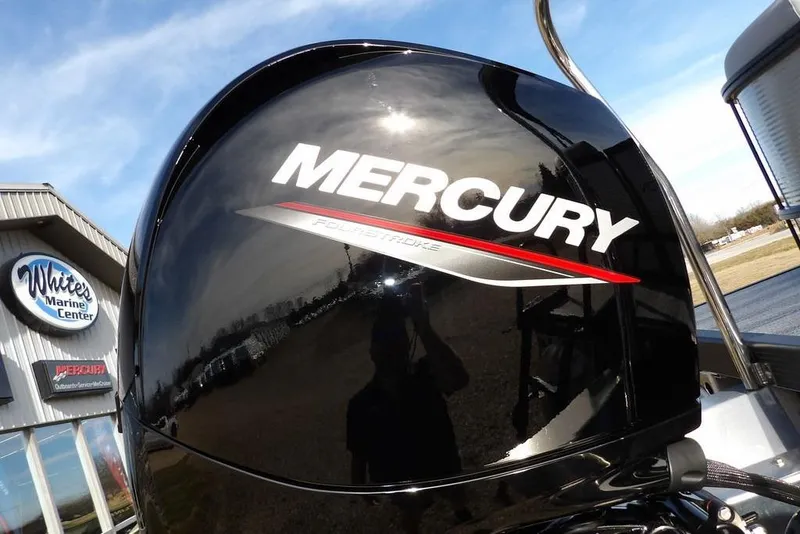 Slide: The Image of Mercury outboard motor at White's Marine Center, near a 2026 Bennington S 22 SSR. - 30