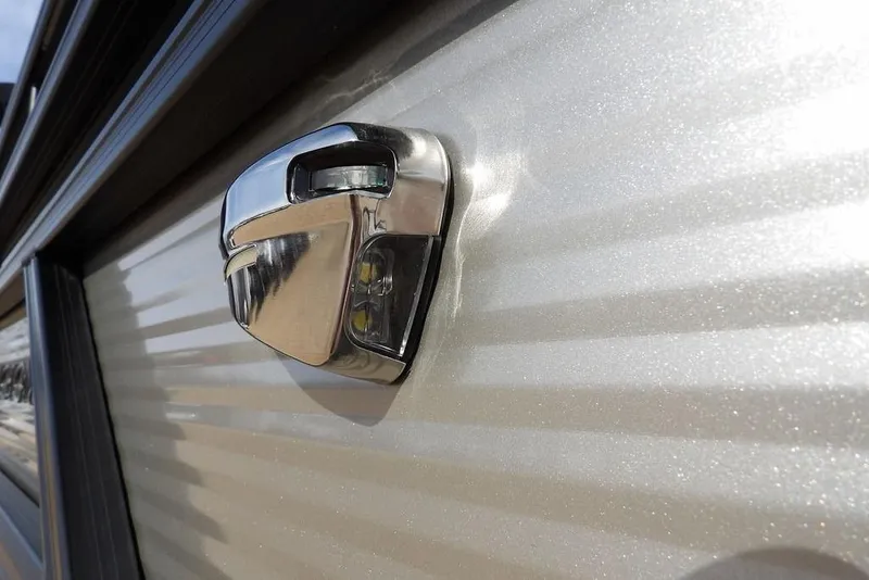 Slide: The Image of 2026 Bennington S 22 SSR chrome detail on metallic surface. - 36