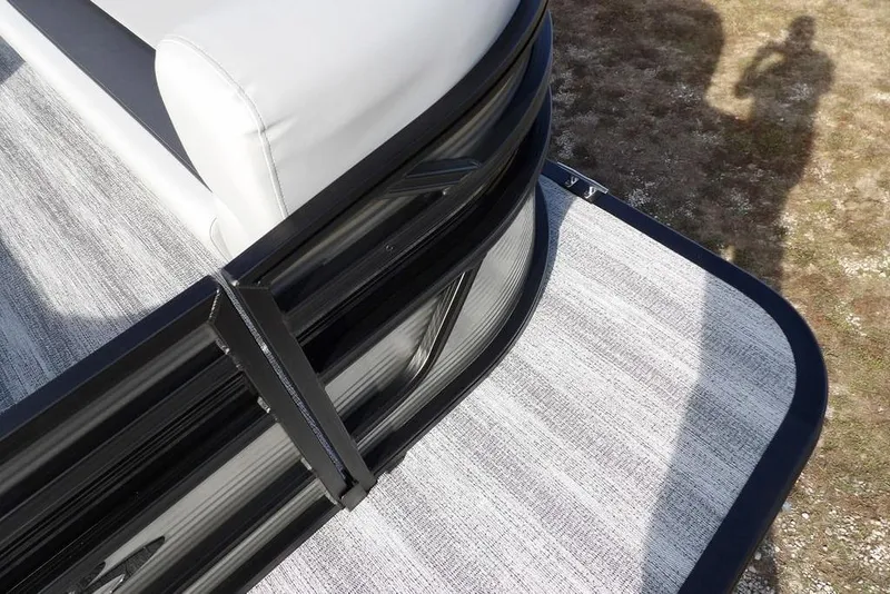 Slide: The Image of 2026 Bennington S 22 SSR pontoon boat corner with white seating and textured flooring. - 8