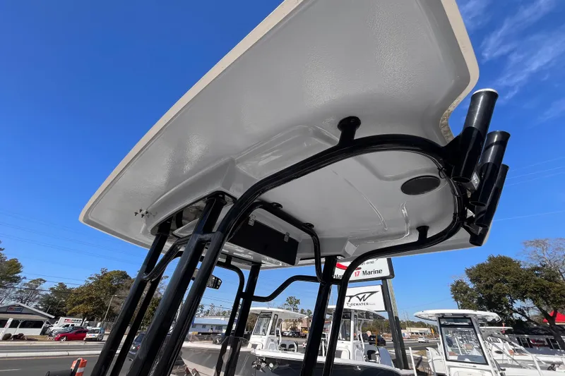 Slide: The Image of 2022 Robalo 226 Cayman boat T-top structure under clear blue sky. - 16