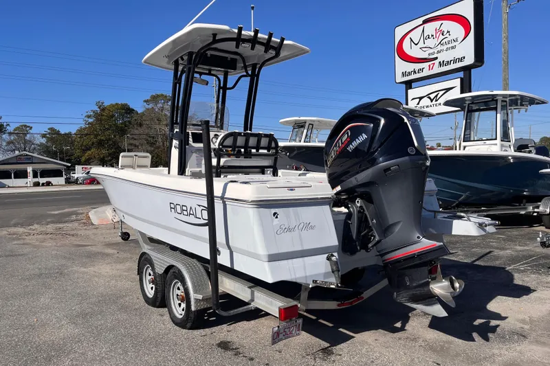 Slide: The Image of 2022 Robalo 226 Cayman boat with Yamaha engine on trailer at Marker 17 Marine. - 2