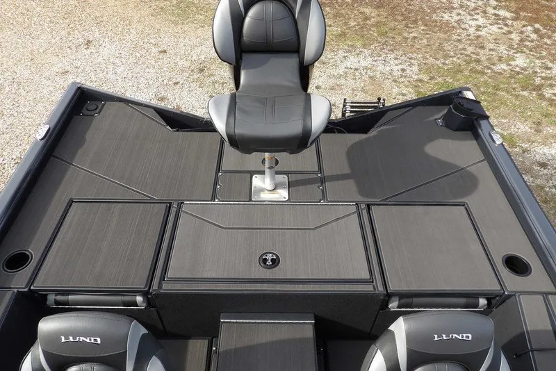 Slide: The Image of 2026 Lund 1975 Renegade boat deck with seating and storage compartments. - 12