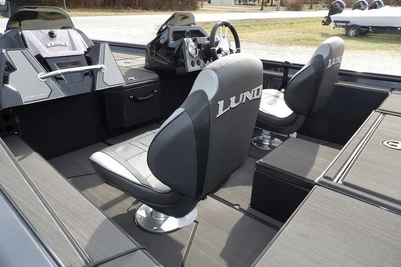 Slide: The Image of Interior of 2026 Lund 1975 Renegade boat with sleek seating and modern dashboard. - 13