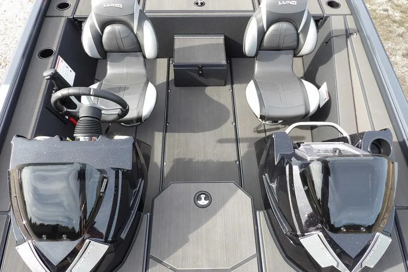Slide: The Image of 2026 Lund 1975 Renegade boat interior with dual seats and steering console. - 16