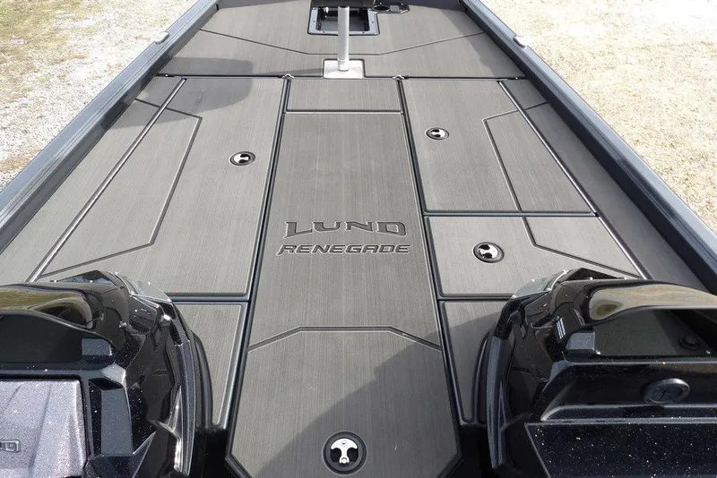 Slide: The Image of 2026 Lund 1975 Renegade boat deck with sleek design and storage compartments. - 21