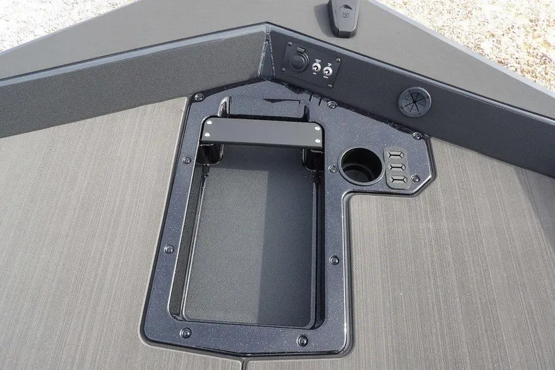 Slide: The Image of 2026 Lund 1975 Renegade boat deck with storage compartment and control panel. - 29