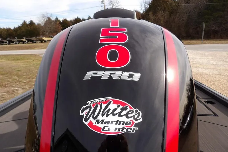 Slide: The Image of Outboard motor with "150 PRO" and "White's Marine Center" decals, Lund 1975 Renegade, 2026 model. - 32