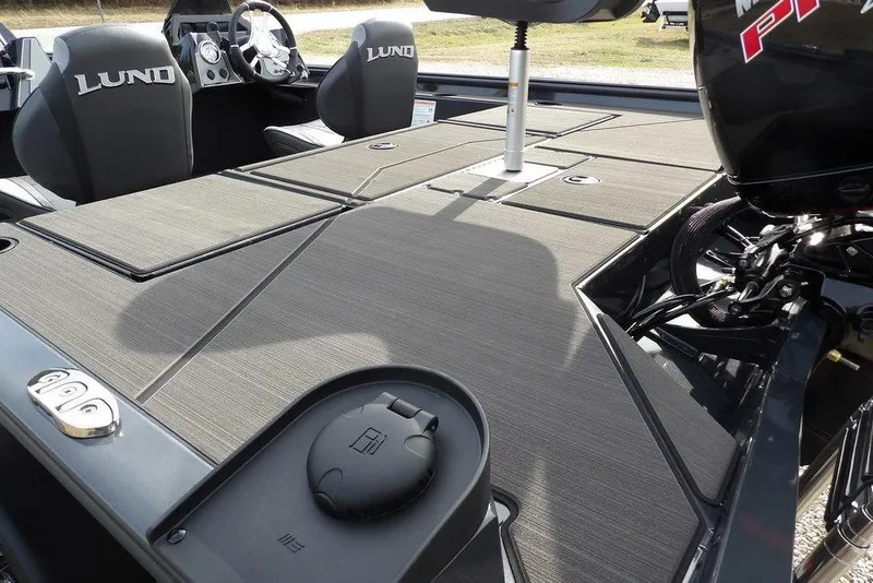 Slide: The Image of 2026 Lund 1975 Renegade boat interior with sleek seating and modern controls. - 4